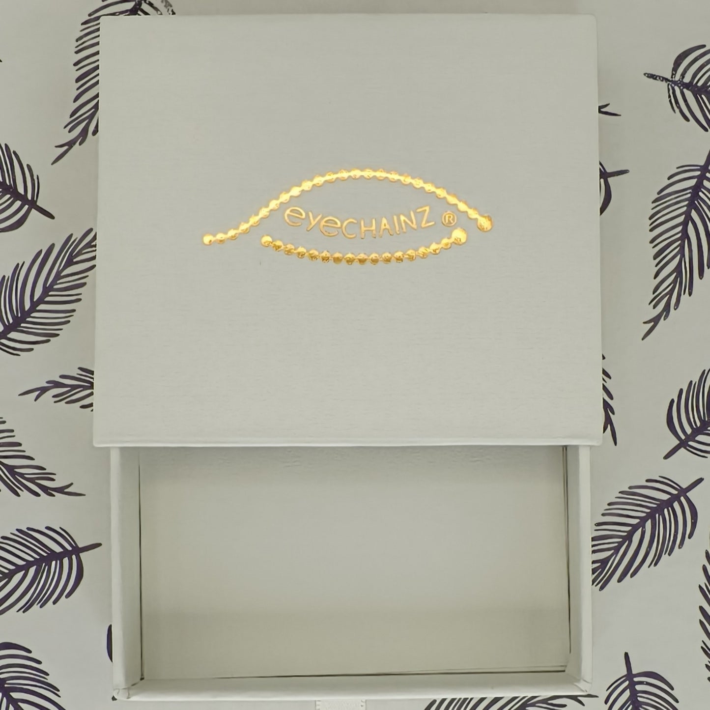 Eyechainz Branded Storage Box, with open drawer.